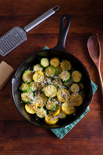 Zucchini and Crookneck (Yellow) Squash sautéed with Vidalia Onions in a Cast Iron Skillet and Topped with Parmesan Cheese.