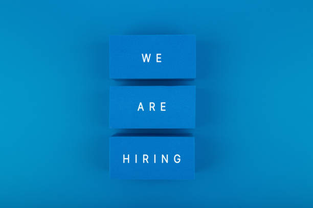 job opening concept. we are hiring written on blue toy blocks against blue background - help wanted sign fotos imagens e fotografias de stock