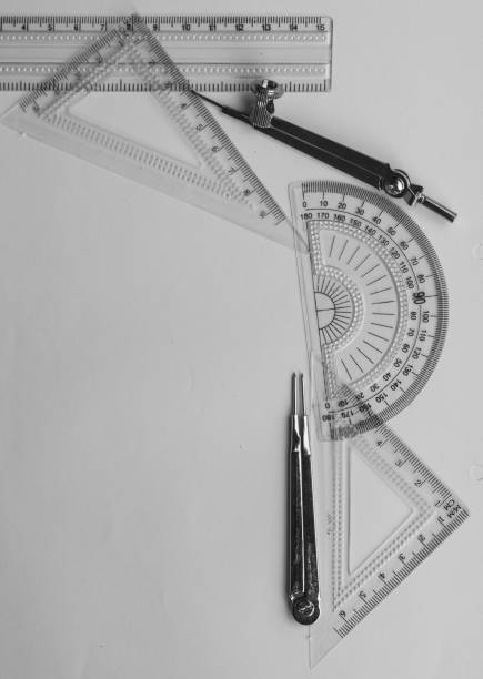 istock Geometric Measuring tools, Drawing items and mathematical instruments placed on white paper sheet. Back to school and Engineering education background. Copy space room for text. 1332509869