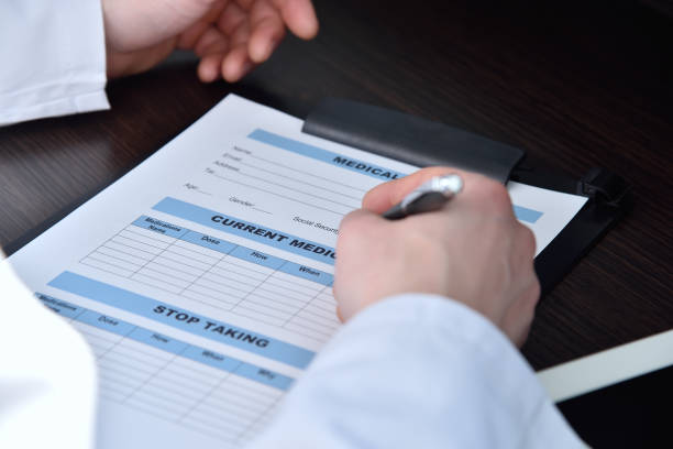 istock Doctor writing on clipboard 1332511851