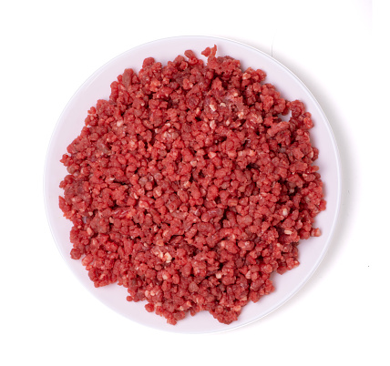 raw minced meat beef in white bowl top view isolated on white background