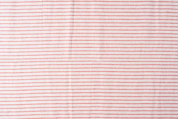 istock Cotton fabric in red and white stripes 1332514260