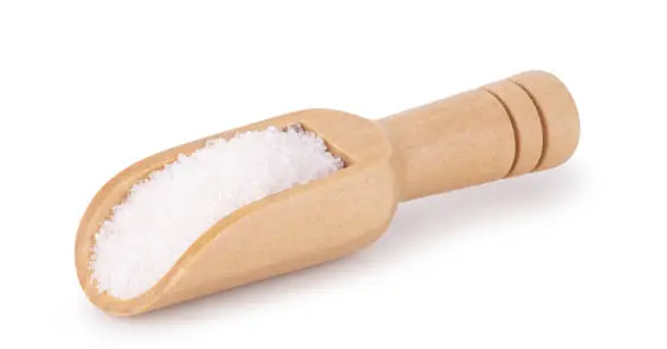 Photo of Wooden spoon or scoop with sugar isolated on white background