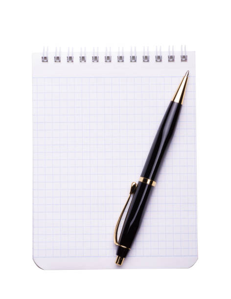istock Black Ballpoint pen on a blank note pad isolated on white background 1332515256