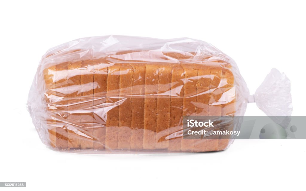 Sliced white bread in plastic bag isolated on white background Sliced white bread in plastic bag isolated on white background. Loaf of Bread Stock Photo