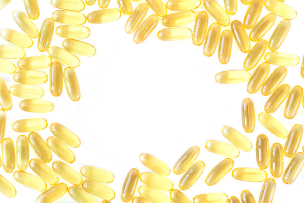 Frame of cod liver or fish oil with omega 3 capsules, supplements for help your health top view. Copy space