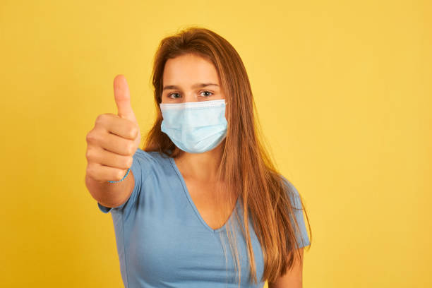 istock Young woman wearing face mask 1332518872