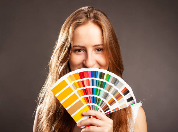 istock interior designer woman holding a color guide palette 1332518891