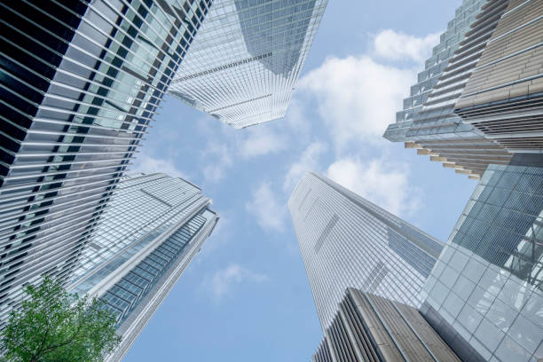 istock Skyscrapers under blue sky and white clouds in downtown district 1332519029