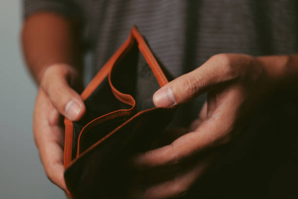 Poor man hand open empty wallet looking for money, broke, bankrupt concept Poor man hand open empty wallet looking for money, broke, bankrupt concept empty pockets stock pictures, royalty-free photos & images