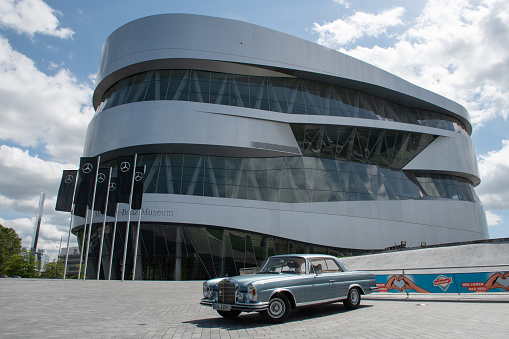 Stuttgart, Germany - July 31, 2021: A classic car parked outside the Mercedes-Benz Museum, designed by Ben van Berkel and UNStudio.