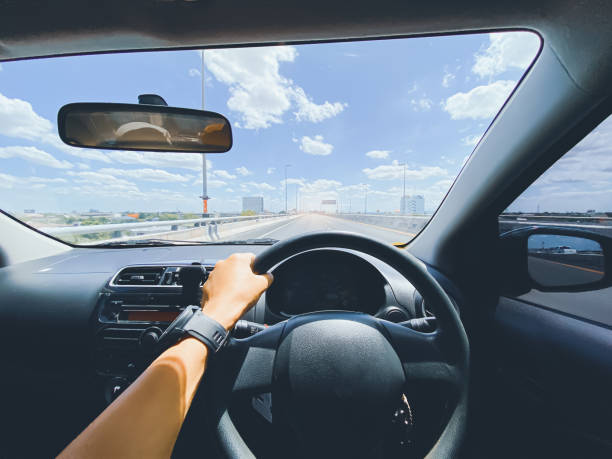 istock driving on the road, drivers point of view. 1332523127