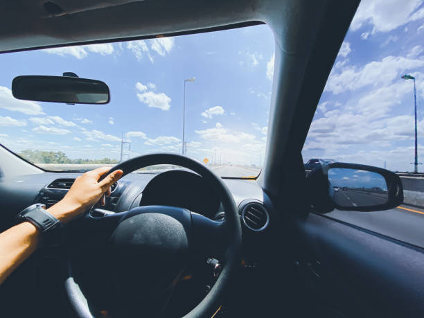 istock driving on the road, drivers point of view. 1332523159