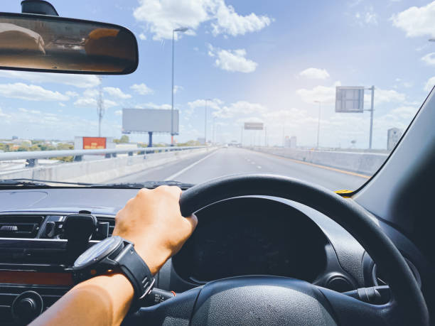 istock driving on the road, drivers point of view. 1332523191