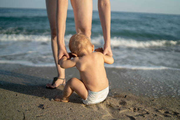istock Baby at the beach 1332524374