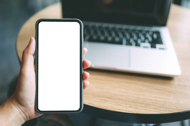 istock Women's hands holding cell telephone blank copy space screen. smartphone with blank white screen isolated on white background . smart phone with technology concept 1332524755