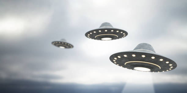 Blurry grey UFO flying in dull sky with mock up place. Spaceship, invasion, mystery and science concept. 3D Rendering. stock photo