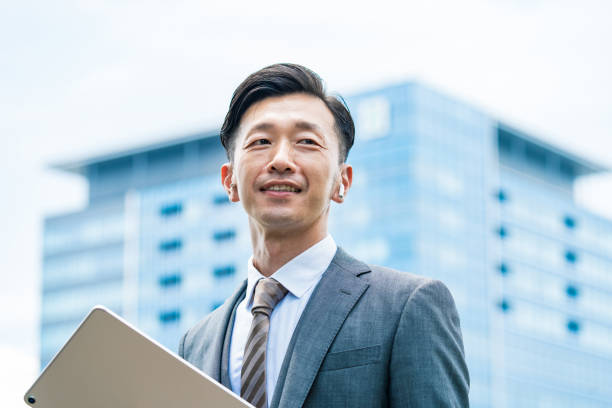 istock A businessman standing in the office district with a smile 1332531133