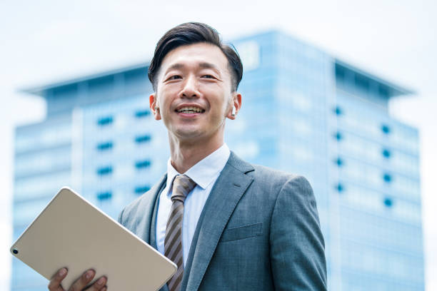 istock A businessman standing in the office district with a smile 1332531226