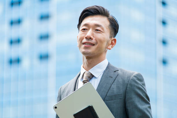 istock A businessman standing in the office district with a smile 1332531815