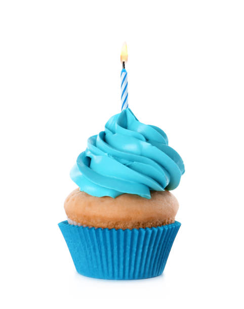 вкусный кекс на день рождения со свечой, выделенной на белом - cupcake cake birthday candy стоковые фото и изображения