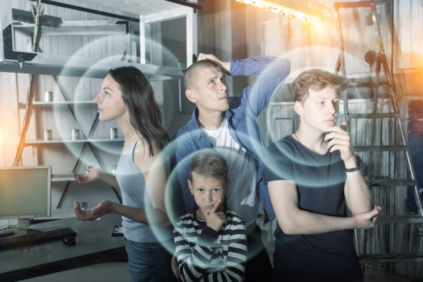 istock Family solving conundrums in quest room stylized as bunker 1332536604