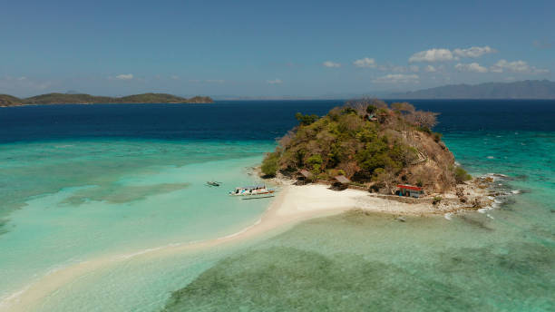 istock Small torpic island with a white sandy beach, top view 1332536862