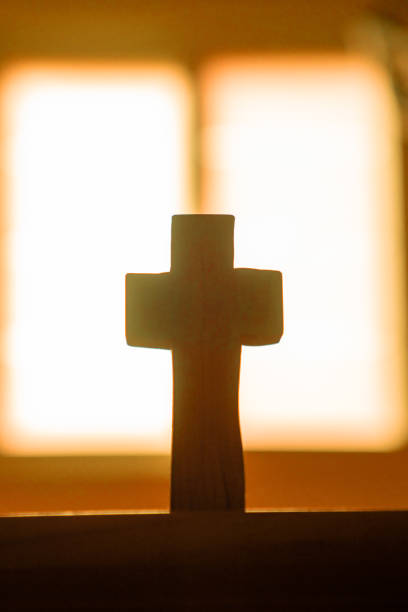 istock Light and Wooden Cross 1332537690