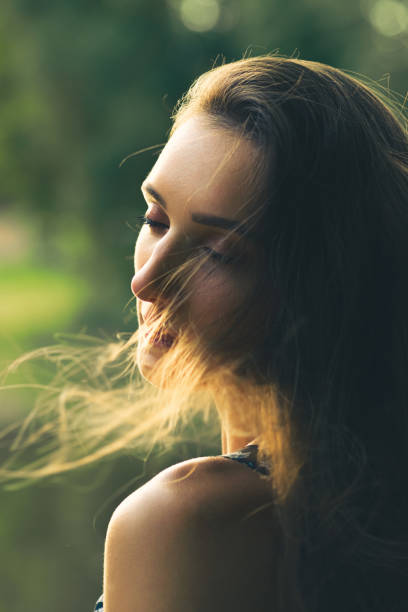 istock Woman portrait during summer sunset in nature 1332537721