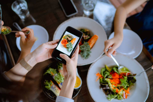 istock Friend group enjoy eating breakfast together at restaurant. 1332537996