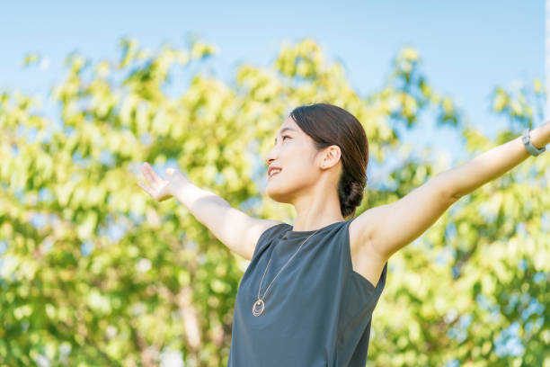 istock Young woman relaxing in the green 1332539308