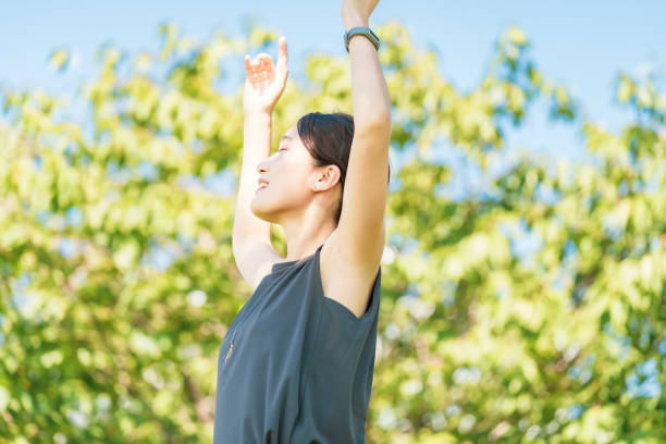 istock Young woman relaxing in the green 1332539320