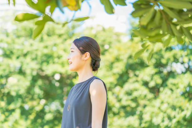istock Young woman relaxing in the green 1332539396