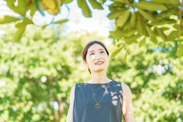 istock Young woman relaxing in the green 1332539545