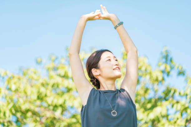 istock Young woman relaxing in the green 1332539697