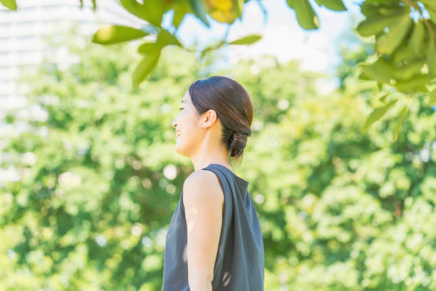istock Young woman relaxing in the green 1332539722