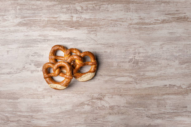 istock pretzels on background on wood table 1332541692