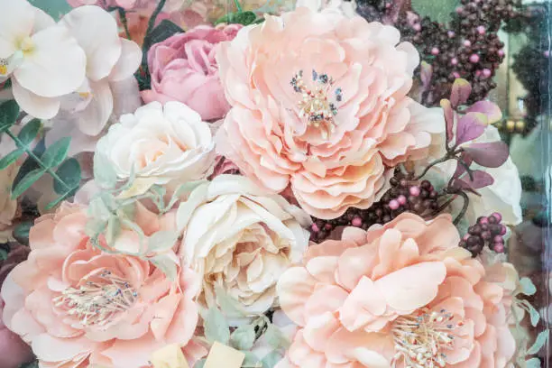 Photo of Flowers of pink shades, vintage pastel background, handmade romantic decor