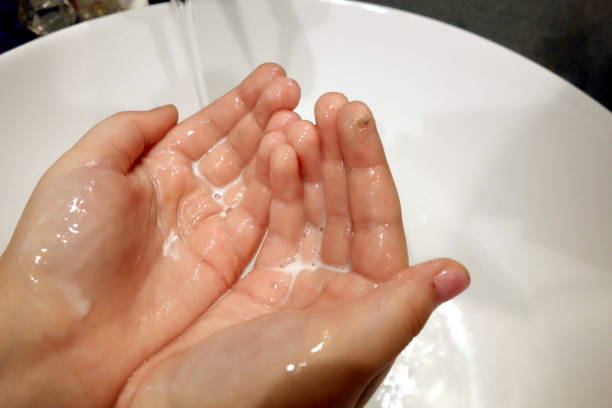 istock Child hands washing in washbasin 1332547264