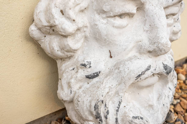 istock Stone face statue garden ornament 1332548487