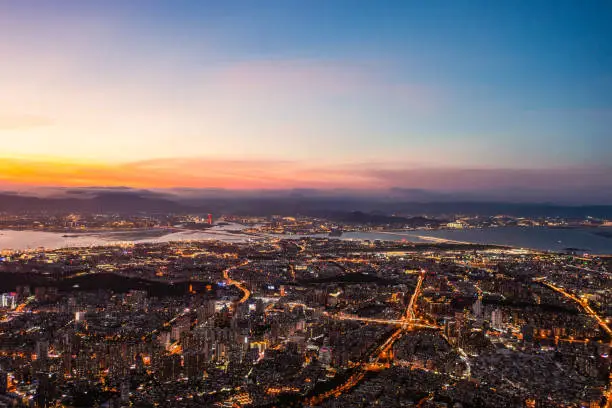 Aerial view of city night lights after sunset in Xiamen, China