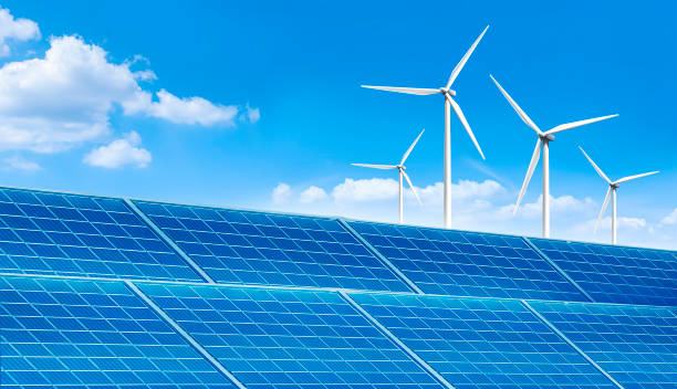 istock solar panel industry and wind turbine in the blue sky. 1332549415