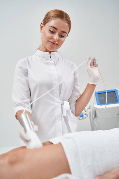 istock Joyful young woman doing massage for lady 1332550608