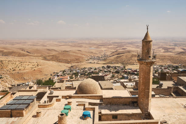 Panoramic view of Mardin city roofs Panoramic view of Mardin Sanitary historical Emir Hamam baths, city roofs and Mesopotamian plain. South-eastern part of Turkey. grand mosque photos stock pictures, royalty-free photos & images