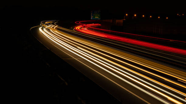 istock lights of cars with night. 1332552529