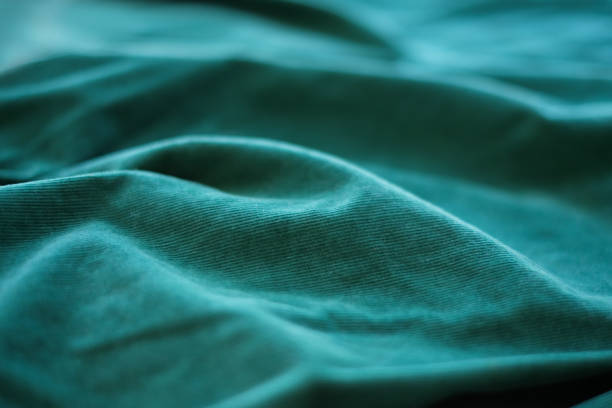 istock Dark green cotton velvet fabric as background 1332552574