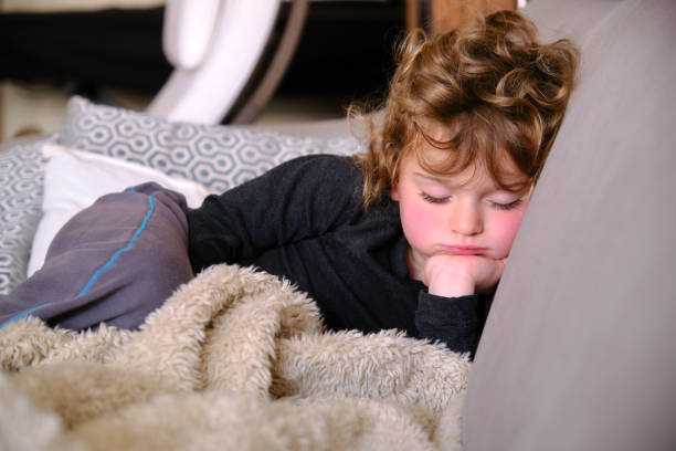 istock Adorable little child sleeping in sofa 1332555349