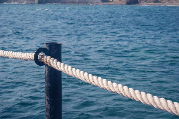 istock A post and rope of a pier. 1332555462