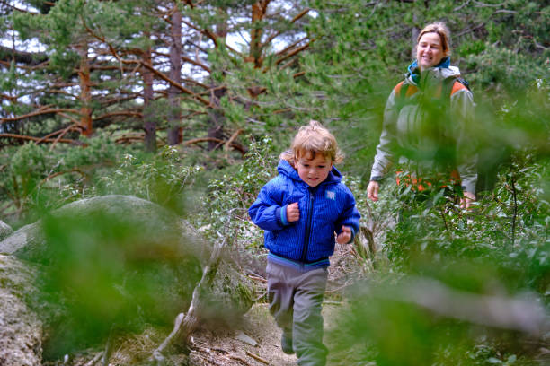 istock Mother and son hiking on path in nature 1332555484
