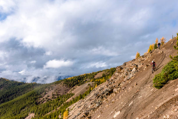 istock View of mountain bikers traversing mountain ridge 1332555576